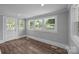 Bright and airy living room featuring wood floors and big windows at 1025 Old Us 80 Hwy, Gold Hill, NC 28071