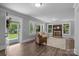 Bright living room with lots of windows, featuring hardwood floors, a fireplace, and neutral paint at 1025 Old Us 80 Hwy, Gold Hill, NC 28071