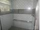 Tiled shower with glass enclosure and modern shower head at 10615 Elm Bend Dr, Charlotte, NC 28273