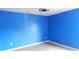 A bedroom featuring a vibrant blue wall and modern flooring at 10615 Elm Bend Dr, Charlotte, NC 28273