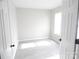 Bedroom with neutral walls, bright natural light and modern floors at 10615 Elm Bend Dr, Charlotte, NC 28273