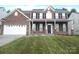 Charming brick home with a well-manicured lawn and attached two-car garage at 10615 Elm Bend Dr, Charlotte, NC 28273