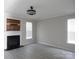 Living room featuring wood flooring, a fireplace, and natural light at 10615 Elm Bend Dr, Charlotte, NC 28273