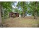 Expansive backyard with mature trees and fire pit at 110 Hidden Valley St, Cherryville, NC 28021