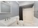 Cozy bathroom featuring a shower/tub combo and a white sink at 110 Hidden Valley St, Cherryville, NC 28021