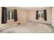 Bright bedroom with neutral walls, plush carpet, and good natural light from multiple windows at 110 Hidden Valley St, Cherryville, NC 28021