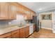Functional kitchen with granite countertops, wooden cabinets, and modern appliances at 110 Hidden Valley St, Cherryville, NC 28021