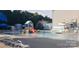 Community pool featuring water slides and splash pad for summer fun at 12314 Chickasaw Dr, Huntersville, NC 28078