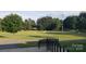 Well-maintained sports field with soccer goals and a scoreboard surrounded by lush trees at 12314 Chickasaw Dr, Huntersville, NC 28078