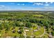 Aerial shot of the property highlighting the large lot with tree coverage at 124 Island Park Ln, Statesville, NC 28625