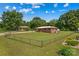 Aerial view of a charming brick house with a well-manicured lawn at 124 Island Park Ln, Statesville, NC 28625