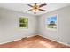 Bedroom features hardwood floors and two windows for natural light at 124 Island Park Ln, Statesville, NC 28625