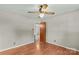 Bright bedroom with hardwood floors, ceiling fan, and neutral wall paint at 124 Island Park Ln, Statesville, NC 28625