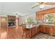 Open concept kitchen and living room area with stone fireplace and breakfast bar at 124 Island Park Ln, Statesville, NC 28625