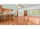 Open concept living space with hardwood floors, a breakfast bar, and seamless access to the kitchen at 124 Island Park Ln, Statesville, NC 28625