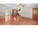 Open floorplan with hardwood floors connecting the living room and kitchen featuring a breakfast bar at 124 Island Park Ln, Statesville, NC 28625