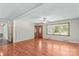 Spacious living room featuring hardwood floors and a neutral color scheme with an adjacent doorway at 124 Island Park Ln, Statesville, NC 28625