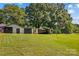 Wide shot of backyard and metal outbuildings, providing ample storage space at 124 Island Park Ln, Statesville, NC 28625