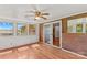 Enclosed sun room with brick accent wall and lots of natural light at 124 Island Park Ln, Statesville, NC 28625
