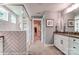 Modern bathroom with herringbone tile shower, double vanity, and walk-in closet at 126 Longwood Rd # 52, Mooresville, NC 28115
