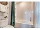 Bright bathroom features a tub with subway tile and green curtains at 126 Longwood Rd # 52, Mooresville, NC 28115