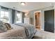 Comfortable bedroom with natural light, soft bedding, and closet access at 126 Longwood Rd # 52, Mooresville, NC 28115