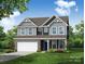 Charming two-story home showcasing a covered porch, stone accents, and a well-manicured lawn at 126 Longwood Rd # 52, Mooresville, NC 28115