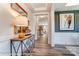 Bright foyer with wood floors, stylish console table, and a view into the open-concept living spaces at 126 Longwood Rd # 52, Mooresville, NC 28115
