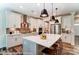 Modern kitchen with a large island, pendant lighting, stainless steel appliances, and custom cabinetry at 126 Longwood Rd # 52, Mooresville, NC 28115