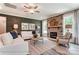 Cozy living room with stone fireplace, neutral furniture, and large windows at 126 Longwood Rd # 52, Mooresville, NC 28115