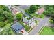 Aerial view of a modern home with a green roof and manicured lawn in a suburban neighborhood at 129 French St, Charlotte, NC 28216