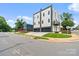 Modern home with a two-car garage, second-story balcony, and landscaped front yard at 129 French St, Charlotte, NC 28216