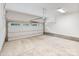 Clean, empty two car garage with white walls and concrete floor, ready for your personal touch at 129 French St, Charlotte, NC 28216