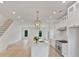 Bright, modern kitchen with white cabinets, stainless steel appliances, and a large center island at 129 French St, Charlotte, NC 28216