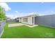 Rooftop patio featuring artificial grass, wood-look decking, modern railings, and a partial view at 129 French St, Charlotte, NC 28216