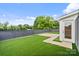 Outdoor rooftop patio features artificial grass, wood-look decking, modern railings, and a partial view at 129 French St, Charlotte, NC 28216