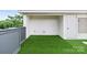 Outdoor rooftop patio features artificial grass, modern railings, and a partial view at 129 French St, Charlotte, NC 28216