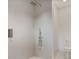 Modern walk-in shower features a rainfall shower head, handheld wand, and a tiled niche at 129 French St, Charlotte, NC 28216