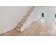 Staircase with wooden stairs and white railing at 129 French St, Charlotte, NC 28216