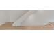 Staircase with wooden stairs and white railing at 129 French St, Charlotte, NC 28216