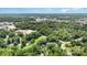 Wide aerial view of the neighborhood featuring trees, roadways, and community amenities at 139 Palaside Ne Dr, Concord, NC 28025