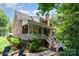 Inviting back porch with white railing and ceiling fan; the perfect spot for relaxing and enjoying the outdoors at 139 Palaside Ne Dr, Concord, NC 28025