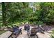 Charming backyard firepit surrounded by Adirondack chairs, perfect for outdoor entertaining at 139 Palaside Ne Dr, Concord, NC 28025