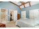 Primary bedroom with exposed beams, high ceilings, and en suite bathroom at 139 Palaside Ne Dr, Concord, NC 28025