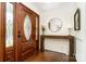 Elegant entryway with hardwood floors, decorative glass front door, and a stylish wood console table at 139 Palaside Ne Dr, Concord, NC 28025