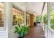 Covered porch featuring a ceiling fan and outdoor seating space with views of backyard at 139 Palaside Ne Dr, Concord, NC 28025