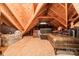 Spacious unfinished attic with wooden beams, offering potential for storage or customization at 14533 Holly Springs Dr, Huntersville, NC 28078