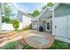 Charming backyard featuring a stone patio, perfect for outdoor dining and entertaining at 14533 Holly Springs Dr, Huntersville, NC 28078