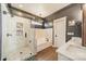 Bathroom with a shower, tub, and marble countertop at 14533 Holly Springs Dr, Huntersville, NC 28078