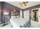 Bedroom with a ceiling fan, large closet, and view of the side yard at 14533 Holly Springs Dr, Huntersville, NC 28078